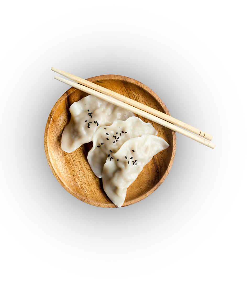 A wooden bowl with some dumplings and chopsticks