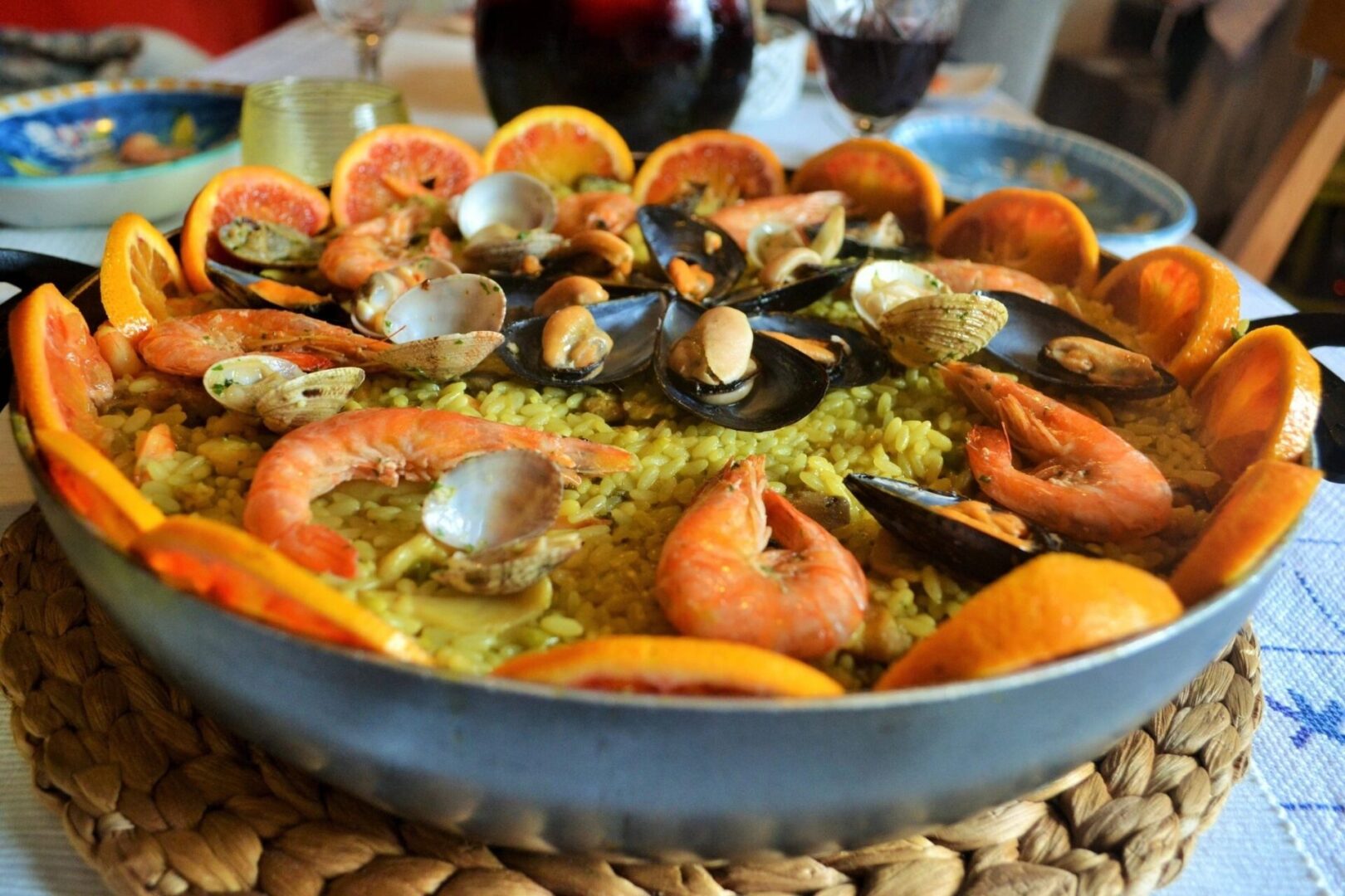 A bowl of food with seafood and other foods.